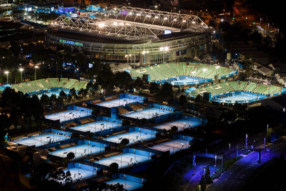 Night-time view of the massive 24-hard court Australian Open facility in Melbourne, Australia - © Gordon Bell / Shutterstock